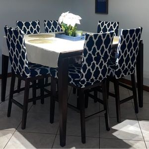 6 chair covers, white and blue with designs.